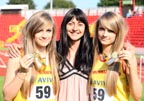 Former Great Britain and England 400 metres athlete Angela Piggford with her twin daughters Emma (left) and Jenny after being members of the Junior Girls 4x100 metres team who won the gold medal at the 2011 Aviva English Schools' 81st Track and Field Championships, Gateshead International Stadium